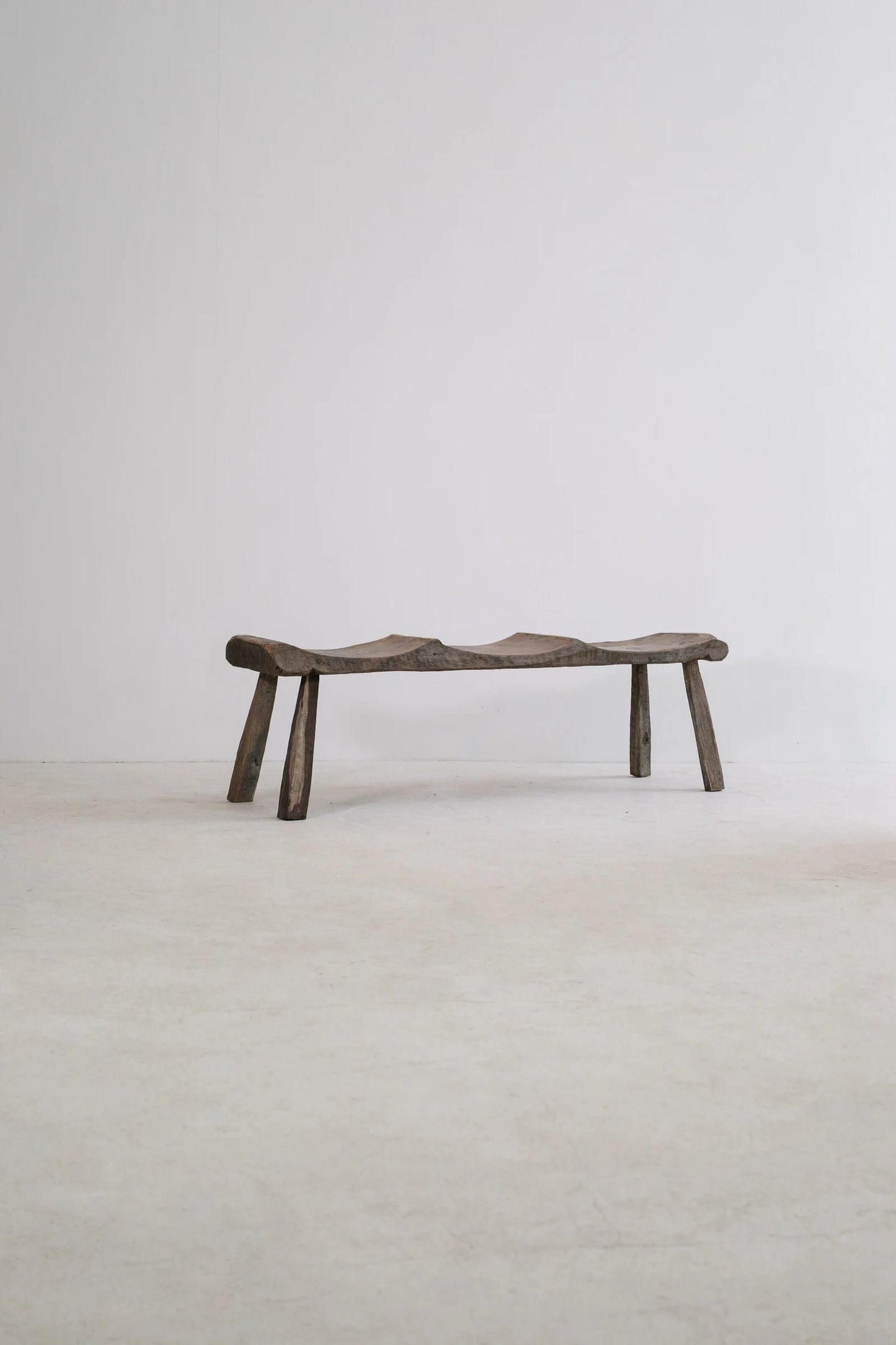 PRIMITIF BENCH TAPERED LEG CURVED SEAT