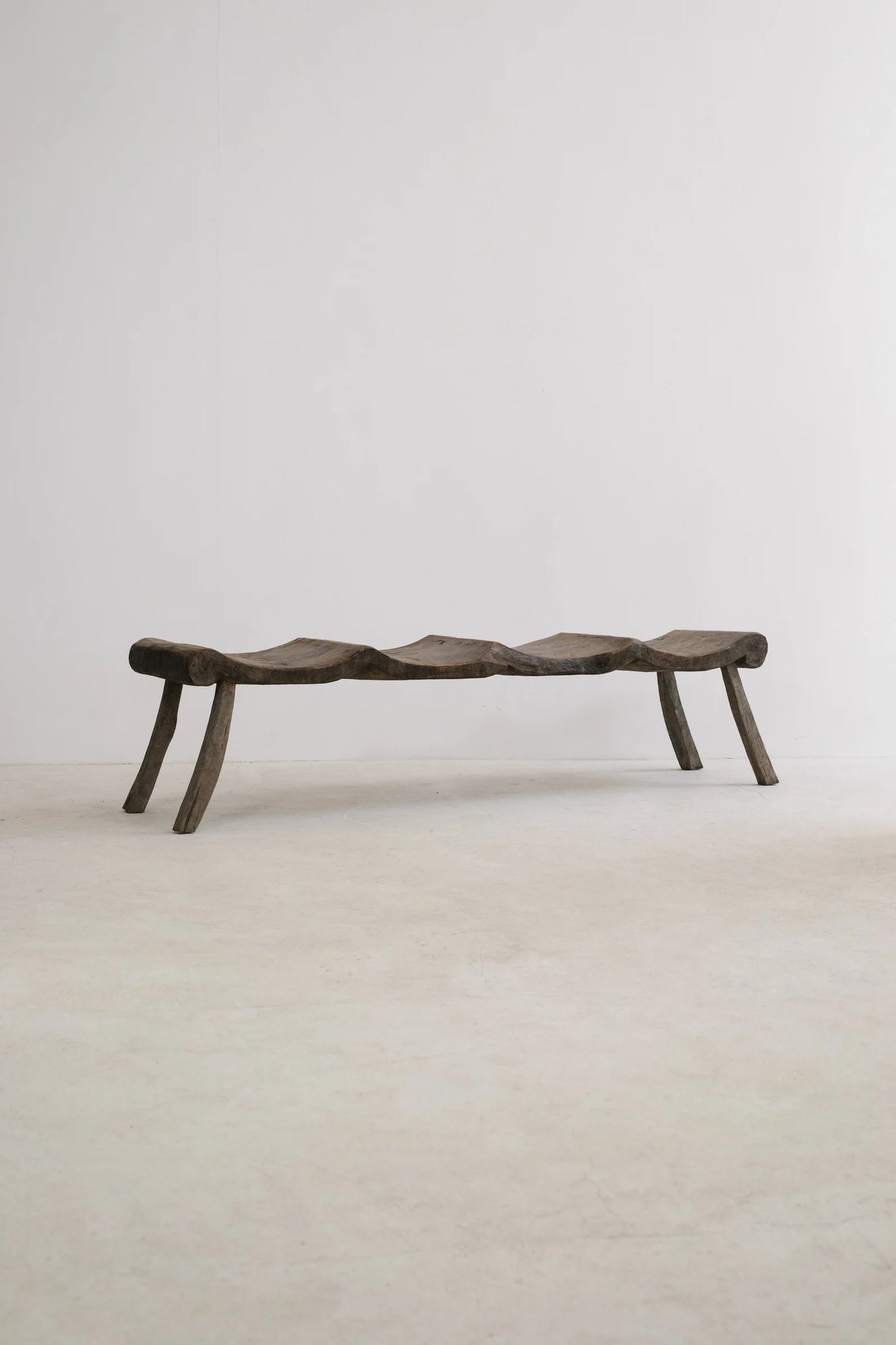 PRIMITIF BENCH TAPERED LEG CURVED SEAT